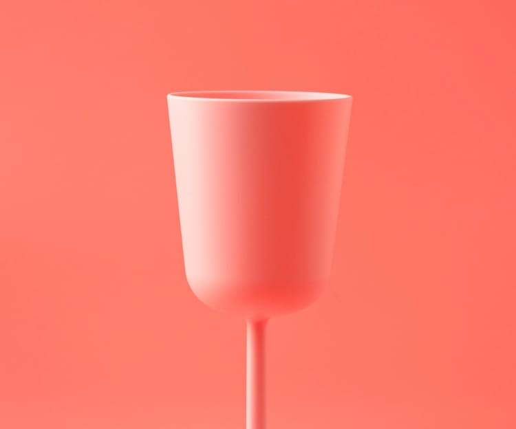 A narrow plastic wine glass.